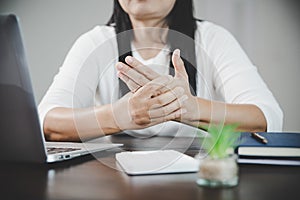 Arthritis person, finger woman ache from working in office. Concept office syndrome hand pain from occupational disease, woman