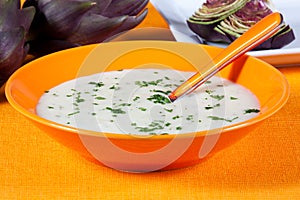 Artichoke biological soup in a dish