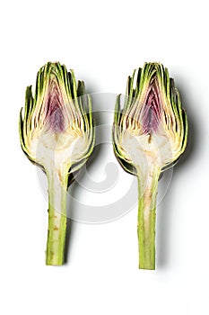 Artichoke - Green Artichoke `Carciofo` Cut Open On White Background photo