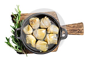 Artichoke hearts pickled in olive oil with herbs and spices Isolated, white background.