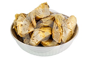 Artichoke hearts pickled in olive oil on white background