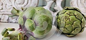 Artichokes and background from vintage rustic decorative element. Wood carving.