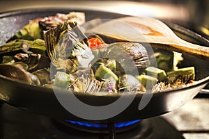 Artichokes cooked in a pan