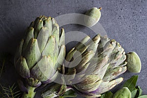 Artichokes on gray background with copy space