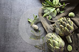 Artichokes on gray background with copy space