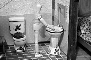 Articulated mannequin in the bathroom of a rural house photo