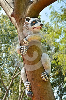 Artifact of panda climbed on a tree in a garden