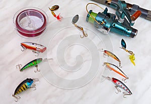 Artificial baits and fishing tackle as a frame for inscription, text