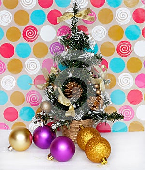 Artificial Christmas fir tree with balls and pine cone