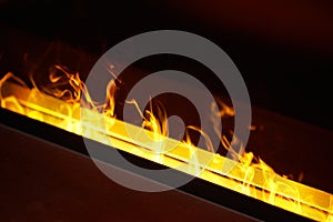 Artificial fireplace. Burning logs. Decorative fire