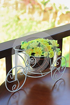 Artificial flower on bicycle toy for decoration