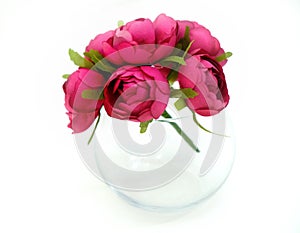 Artificial flower and glass vase on white background, wedding interior detail close up