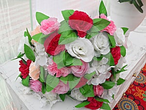 Artificial flower placed on table