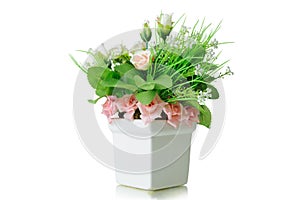 Artificial flowers bouquet in vase isolated on white background