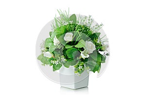 Artificial flowers bouquet in vase isolated on white background