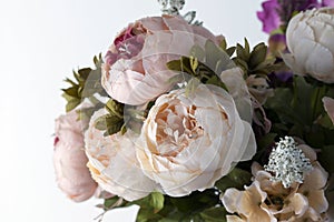 artificial flowers peonies on white background