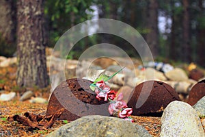 Artificial Flowers and Unearthed WWII Helmets photo