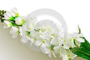 Artificial flowers on white color background