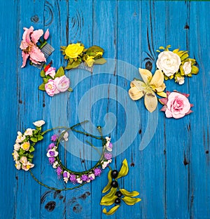 Artificial flowers on a wooden board