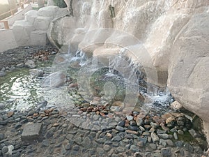 Artificial fountain in zoo Dubai UAE waterfall United Arab Emirates