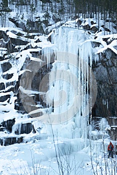 Artificial frozen waterfall for training rock climbers.