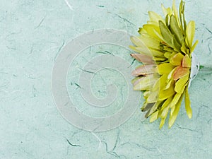 Artificial gerbera flower close up with space copy green background