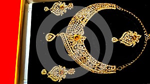 Artificial Gold Color Women Jewelry. Ornaments. Black Background.