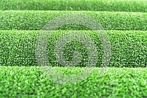 Artificial grass lawn texture. Artificial Turf Background. Greening with an artificial grass. Rolled artificial turf laying backgr