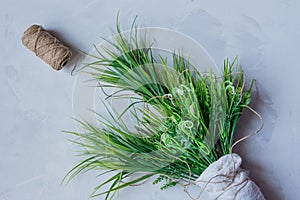 Artificial green grass with brown thread