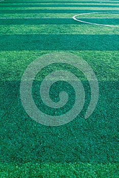 Artificial green grass soccer field background