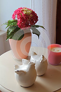 Artificial hydrangea in a vase and decorations