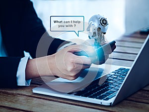 Artificial intelligence, AI chat bot technology concept. Virtual humanoid robot head with speech bubble appear on phone.