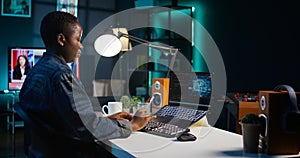 Artificial intelligence engineer working from home using notebook