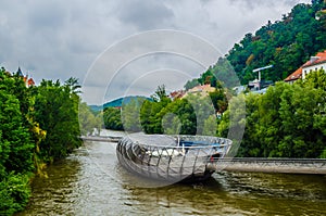 The artificial island on the Mur river in Graz.It is a famous landmark and called Murinsel, very popular for Graz