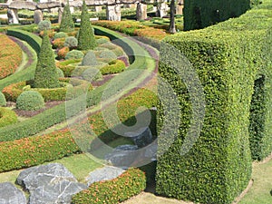 Artificial landscape with trimmed trees and bushes.