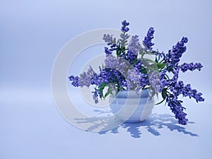 Fake or artificial purple flower isolated white background