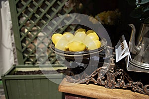 Artificial lemons on vintage scales . Decoration concept