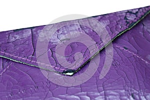 The artificial old leather bag purple. Broken pattern texture background