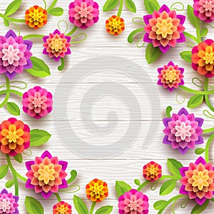 Artificial paper flowers on a white wooden plank background with copy space in the center.