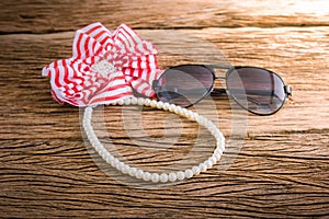 Artificial pearl necklace and sunglasses, Hair bow