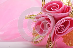 Artificial pink rose bouquet with copyspace for text