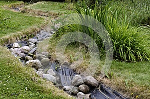 Artificial pond stream and decorative landscaped garden