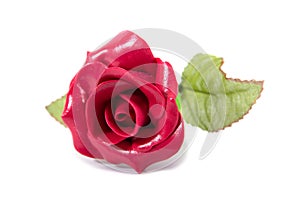 Artificial red rose flower with leaves isolated on white background