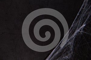 Artificial spider web over black background. Mockup for Halloween