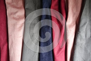 Artificial suede fabrics in different colors folded