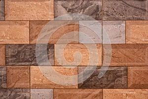 Artificial tile work on wall with stone texture