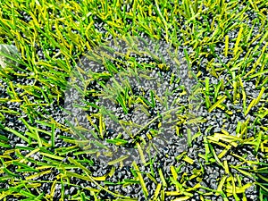 Artificial turf football pitch in deteriorated condition
