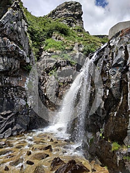 Artificial waterafall near Coca alpine retreat on Orobie mountains