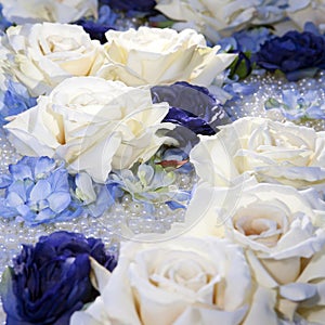 Artificial white and blue roses
