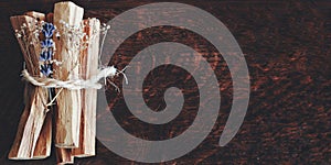Artificially expanded image. Bundle of Palo Santo sticks from Bursera graveolens holy wood tree photo